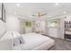 Bright main bedroom with lots of natural light, neutral decor, ceiling fan, and carpet at 4238 E Mitchell Dr, Phoenix, AZ 85018