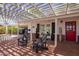 Inviting covered patio with comfortable seating, a red front door, and ample space for relaxation at 4238 E Mitchell Dr, Phoenix, AZ 85018