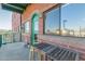 Exterior shot of a balcony with a quaint bistro set offering city views and a cozy outdoor experience at 424 S 2Nd St # 203, Phoenix, AZ 85004