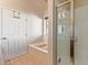 Well-lit bathroom featuring a shower, a separate tub with stylish fixtures and a tiled shower enclosure at 424 S 2Nd St # 203, Phoenix, AZ 85004