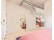 Open bedroom with a view to the bathroom and kitchen featuring an exposed duct, adding an industrial touch at 424 S 2Nd St # 203, Phoenix, AZ 85004