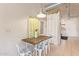 Cozy dining area features a modern rustic wood table and industrial pendant lighting at 424 S 2Nd St # 203, Phoenix, AZ 85004