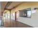 Apartment hallway features natural light, smooth flooring and exposed beams for a sleek, modern appeal at 424 S 2Nd St # 203, Phoenix, AZ 85004