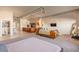 Open living space featuring exposed ductwork, tile and carpet flooring, with a modern, loft-like ambiance at 424 S 2Nd St # 203, Phoenix, AZ 85004