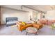 Open living area featuring modern furniture, carpeting, and an open floor plan with exposed ductwork at 424 S 2Nd St # 203, Phoenix, AZ 85004