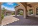Covered back patio featuring arched columns, a spa, and an outdoor lounge area at 4327 E Capricorn Pl, Chandler, AZ 85249