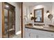 Elegant bathroom with a glass door shower and framed mirror at 4327 E Capricorn Pl, Chandler, AZ 85249