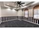 Large bedroom featuring stylish striped walls, plush carpet, and wooden shutters at 4327 E Capricorn Pl, Chandler, AZ 85249