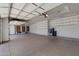 Large garage with storage shelving and ample space at 4327 E Capricorn Pl, Chandler, AZ 85249