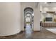Hallway features arched doorways and brick flooring at 4327 E Capricorn Pl, Chandler, AZ 85249