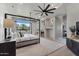 Bedroom showcasing natural light, a four-poster bed, a ceiling fan, and a fireplace at 4327 E Capricorn Pl, Chandler, AZ 85249