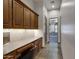 Functional office space with custom wood cabinets and counter space, leading to rooms with natural light at 4327 E Capricorn Pl, Chandler, AZ 85249