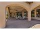 Covered patio with stone tile, chaise lounges and overhead fans, great for entertaining or relaxation at 4327 E Capricorn Pl, Chandler, AZ 85249