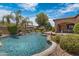 Inviting backyard pool with waterfall features and lush landscaping, perfect for relaxation and entertainment at 4327 E Capricorn Pl, Chandler, AZ 85249