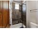 Cozy bathtub and shower featuring slate-style tiling at 4327 E Capricorn Pl, Chandler, AZ 85249