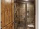 Close-up of a modern shower with a glass door and stone-tile walls at 4327 E Capricorn Pl, Chandler, AZ 85249