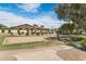 Sand volleyball court in a common area with manicured landscaping and a grassy field at 4327 E Capricorn Pl, Chandler, AZ 85249