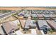 Expansive aerial view of a residential community highlighting neatly planned homes, streets, and vast open spaces at 4371 E Enmark Dr, San Tan Valley, AZ 85143