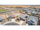 Real estate aerial showing a new development area with modern homes, streets, and open desert landscapes at 4371 E Enmark Dr, San Tan Valley, AZ 85143