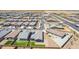 Aerial view showing well-planned community with modern homes, desert landscaping, and open space at 4371 E Enmark Dr, San Tan Valley, AZ 85143