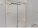Modern bathroom with glass enclosed shower and white door at 4371 E Enmark Dr, San Tan Valley, AZ 85143