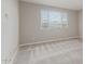 Bedroom featuring neutral-toned walls, carpet flooring, and a window at 4371 E Enmark Dr, San Tan Valley, AZ 85143