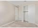 A bedroom features carpet and a closet with shelves at 4371 E Enmark Dr, San Tan Valley, AZ 85143