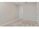 Clean, carpeted room featuring a white door and neutral paint at 4371 E Enmark Dr, San Tan Valley, AZ 85143