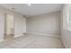 Spacious bedroom featuring neutral carpet, light walls, and ample natural light at 4371 E Enmark Dr, San Tan Valley, AZ 85143