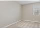 A bright bedroom with neutral carpeting, paint, and a window, ready for personalization at 4371 E Enmark Dr, San Tan Valley, AZ 85143