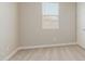 A simple bedroom offers a bright window and neutral tones at 4371 E Enmark Dr, San Tan Valley, AZ 85143
