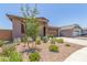 Single-Gathering house featuring a gravel yard with drought-resistant plants and a two-car garage at 4371 E Enmark Dr, San Tan Valley, AZ 85143