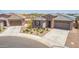 Charming single-Gathering home featuring a desert landscape, private driveway, and attached two-car garage at 4371 E Enmark Dr, San Tan Valley, AZ 85143