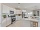 Bright kitchen featuring white cabinetry, stainless steel appliances, and a large island at 4371 E Enmark Dr, San Tan Valley, AZ 85143