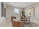 Home office with a work desk, a patterned rug, and two comfy armchairs at 4371 E Enmark Dr, San Tan Valley, AZ 85143
