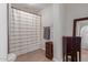 This bathroom features a full shower with curtain and wood-style floors at 4419 W Vogel Ave, Glendale, AZ 85302