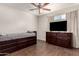 This bedroom features a comfortable sleeping space and a mounted television at 4419 W Vogel Ave, Glendale, AZ 85302