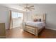 This bedroom offers a ceiling fan and a window that provides natural light and outside views at 4419 W Vogel Ave, Glendale, AZ 85302