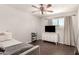 Neutral bedroom featuring hardwood floors, large window and sleek decor at 4419 W Vogel Ave, Glendale, AZ 85302