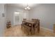 This bright dining area provides a comfortable space for dining, with stylish lighting fixtures at 4419 W Vogel Ave, Glendale, AZ 85302
