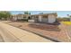Charming home with desert landscaping and a well manicured lawn, offering curb appeal at 4419 W Vogel Ave, Glendale, AZ 85302
