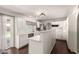 Open kitchen with white cabinetry, stainless steel appliances, and sliding glass door to the outdoor area at 4419 W Vogel Ave, Glendale, AZ 85302