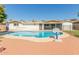 Beautiful in-ground pool and backyard featuring a basketball hoop and covered patio at 4419 W Vogel Ave, Glendale, AZ 85302