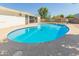 Inviting in-ground pool with a spacious concrete deck, perfect for outdoor relaxation and entertaining at 4419 W Vogel Ave, Glendale, AZ 85302