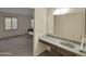 Bathroom with vanity and view into bedroom at 4509 E Joan De Arc Ave, Phoenix, AZ 85032