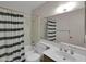 Bathroom featuring a shower-tub combo and a vanity sink at 4509 E Joan De Arc Ave, Phoenix, AZ 85032