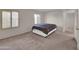Bedroom with neutral carpet, plantation shutters, and a queen bed at 4509 E Joan De Arc Ave, Phoenix, AZ 85032
