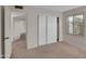Bedroom featuring sliding door closet and plantation shutters at 4509 E Joan De Arc Ave, Phoenix, AZ 85032