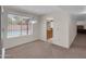 Dining room with a window view of the pool and access to the kitchen and hall at 4509 E Joan De Arc Ave, Phoenix, AZ 85032