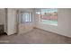 Dining room with a window view of the pool, carpet floors, and a built in china cabinet at 4509 E Joan De Arc Ave, Phoenix, AZ 85032